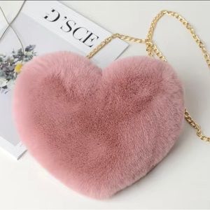 NIB Dusty rose colored faux fur heart shaped purse with chain strap.